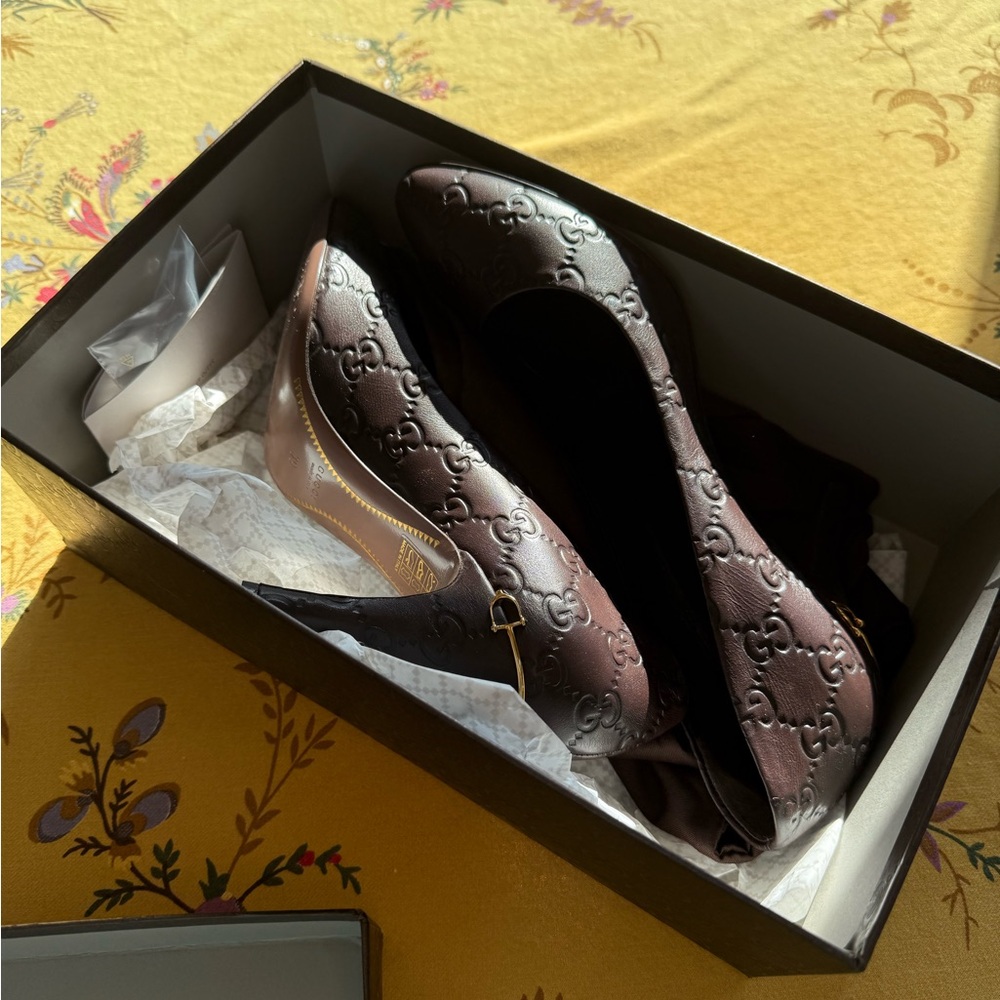 Gucci Women's Chocolate Embossed heels.